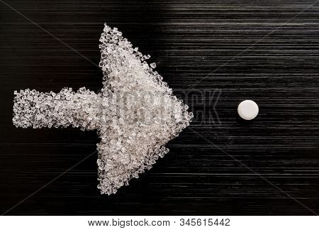 Sweetener Tablets Lying With Sugar On A Dark Background
