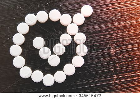 Sweetener Tablets Lying With Sugar On A Dark Background