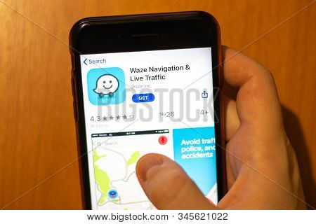 Los Angeles, California, Usa - 17 January 2020: Mobile Phone In Hand With Waze Navigation App Logo O