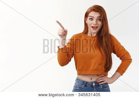 Surprised Happy Impressed Redhead Ginger Girl Wear Makeup Stylish Cropped Top Pointing Upper Left Co