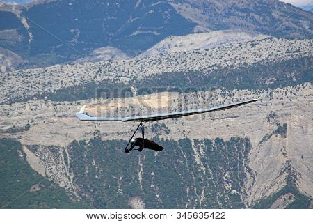 Hang Glider Flying From The Chabre Mountain, France