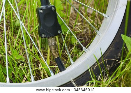 Inflating The Tire Of A Bicycle. Pumping Air Into A Wheel Of Bike. Home Maintenance Of Bike. Bicycle