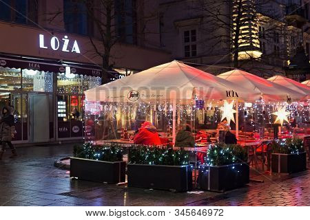 Krakow, Poland - January 06, 2016: Evening Winter View Of The Street Terrace Of The Loza Restaurant 