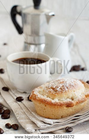Cup Of Coffee With Pasticciotto Pastry On A Rustic Background Close Up