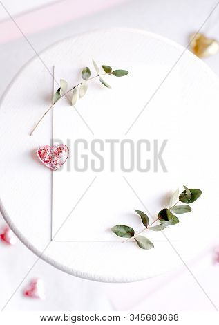Background With Copy Space Blank On White Table With Glitter Heart, Eucalyptus Branch, Flowers And L