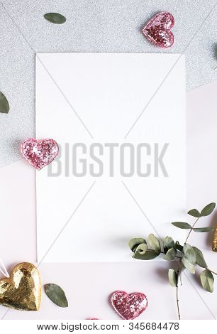 Background With Copy Space Blank On White Table With Glitter Heart, Eucalyptus Branch, Flowers And L