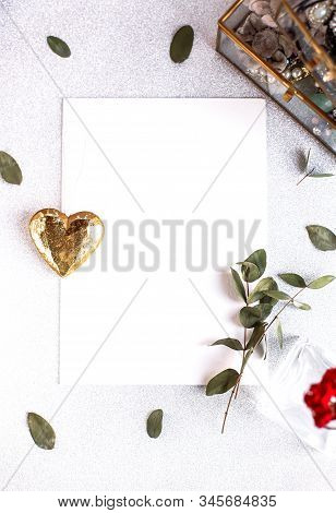 Background With Copy Space Blank On White Table With Glitter Heart, Eucalyptus Branch, Flowers And L