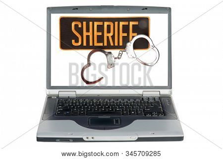 Hand Cuffs. Sheriff Patch with Handcuffs. Computer screen with Sheriff Patch and Handcuffs isolated on white. Room for text. Clipping Path. Bad people have to deal with the law and go to jail.