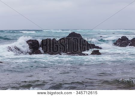 Beautiful Nature Sea Landscape Scene With Black Stone Of Jeju Island, South Korea