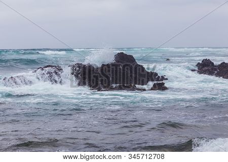 Beautiful Nature Sea Landscape Scene With Black Stone Of Jeju Island, South Korea