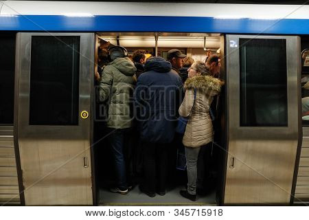 Large Group Of People Crowd To Get In And Out Of The Underground Train In The Victoria Square (piata