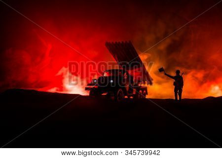Rocket Launch With Fire Clouds. Battle Scene With Rocket Missiles With Warhead Aimed At Gloomy Sky A