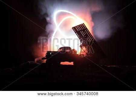 Rocket Launch With Fire Clouds. Battle Scene With Rocket Missiles With Warhead Aimed At Gloomy Sky A