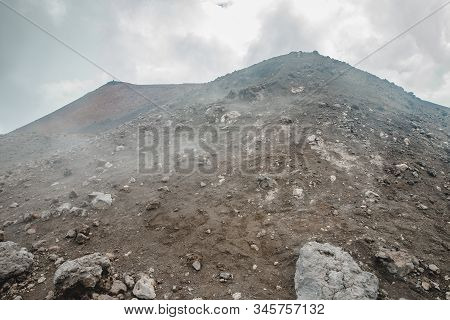 Top Of Crater Mount Etna Volcano, Frozen Cold Lava Smokes, Thick Clouds