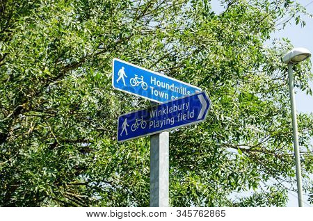 Fingerpost Direction Signs For Pedestrians And Cyclists In Basingstoke, Hampshire. Sunny Summer Day.