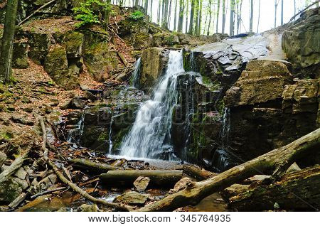 Skakalo Waterfall In The Carpathian Mountains Surrounded By Forest On A Spring Sunny Day
