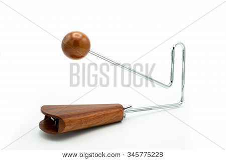 Closeup Of A Vibraslap Silver, Brown Wood On White Underground