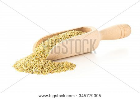 Heap Of Uncooked, Raw Freekeh Or Firik, Roasted Wheat Grain, In Wooden Scoop Over White Background