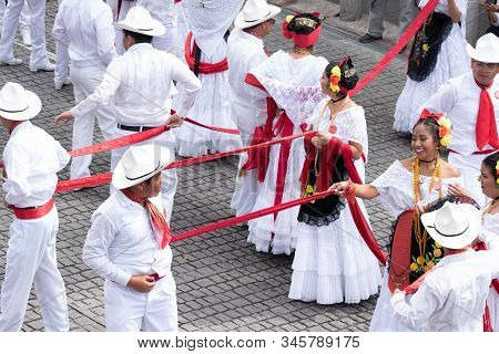 XALAPA, VERACRUZ, MEXICO- NOVEMBER 24, 2019: Young dancers dressed with traditional clothes during t