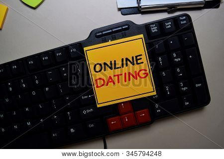 Online Dating Write On A Sticky Note Isolated On Keyboar Computer.