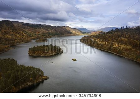 Beautiful aerial drone landscape image of glorious Autumn Fall sun over Thirlmere in Lake District