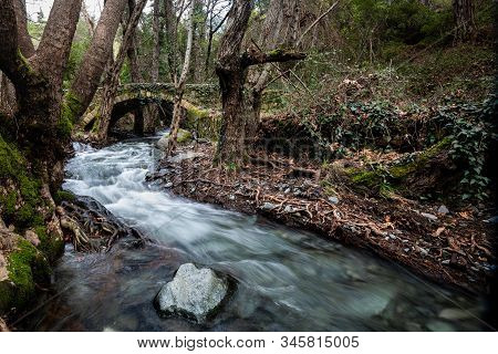 Beautiful Medieval Stoned  Bridge Or Milia With River Full With Water Flowing At Troodos Mountains I