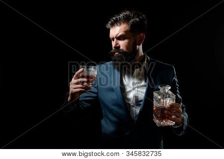 Whisky Elegant. Man With Beard Holds Glass Of Brandy. Bearded Businessman In Elegant Suit With Glass