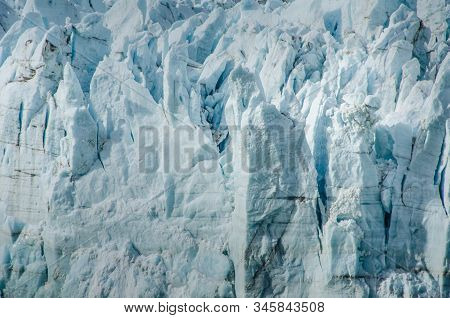 Close-up Of Seracs Caused By Slow-moving Glacial Ice Down A Mountain To The Sea.