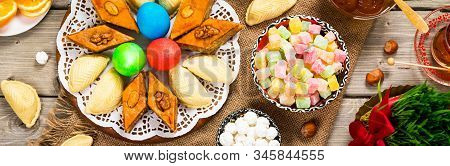 Novruz Ramadan In Azerbaijan. Colored Eggs, Wheat Springs For Easter And Traditional Sweets. Selecti