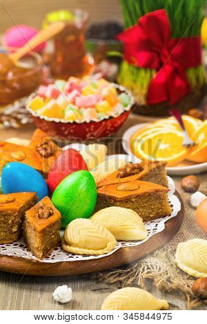 Novruz Ramadan In Azerbaijan. Colored Eggs, Wheat Springs For Easter And Traditional Sweets. Selecti