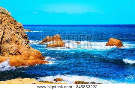 Coast Of Capo Pecora Beach At Mediterranean Sea Sardinia Reflex
