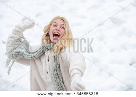 Portrait Of A Excited Woman In The Winter. Cheerful Girl Outdoors. Happy Young Girl Playing Snowball