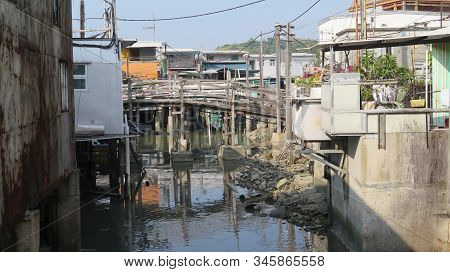 Back Water Of Small Chinese Fishing Village At Low Tide