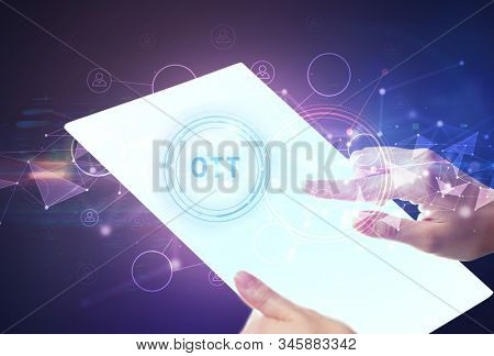 Hand holdig futuristic tablet with OTT inscription, modern technology concept