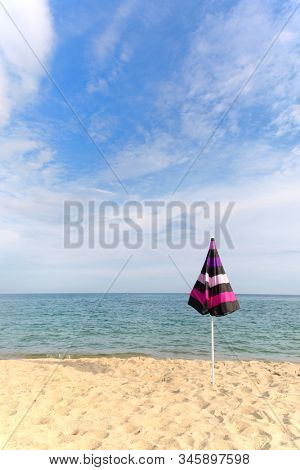 Vacation with shade with umbrella at the beach