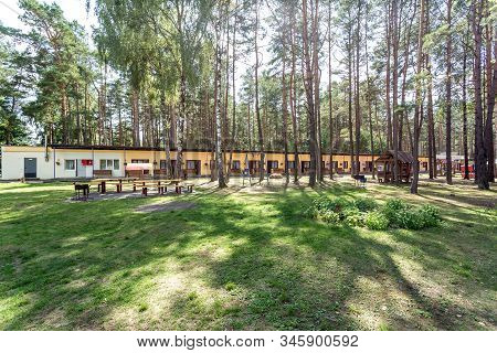 Wooden Camping Arbors  With All Conviniences In A Pine Forest