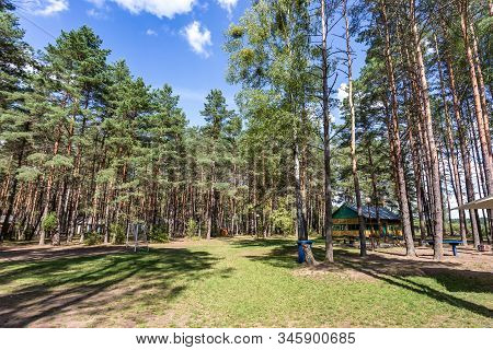 Wooden Camping Arbors  With All Conviniences In A Pine Forest