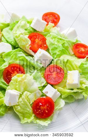 salad with fresh vegetables, feta cheese and tomatoes