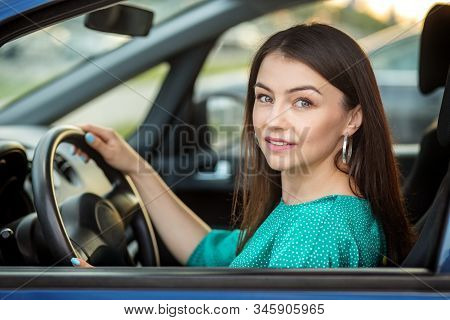 Successful Woman Drives A Car. The Concept Of Transportation, Right To Drive, Business Woman And Ins