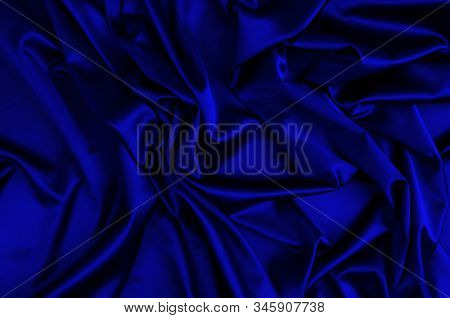 Crumpled blue fabric texture, close vup