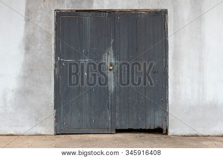 Black Wood Door And Cemen Wall,  The Rusty Lock With Wood Door, Old Lock Close Home Door.