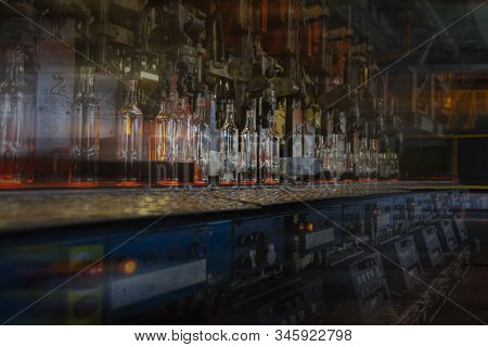 Glassworks. Glass Industry. Glass Bottle During Conveyor Belt Manufacturing