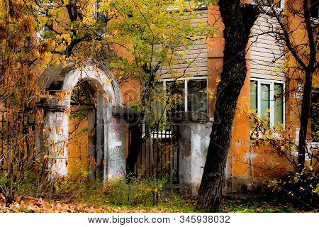 Old White Arch With A Rickety Wicket On A Background Of Autumn