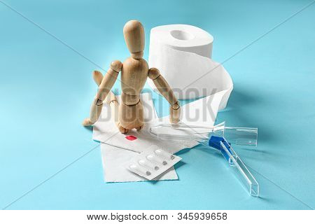 Composition With Anoscope On Light Blue Background. Hemorrhoid Treatment