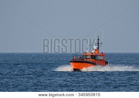 Pilot Boat -  Orange Auxiliary Boat On The Water