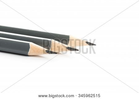 Three  Gray Triangular Pencil Isolated
On White Background