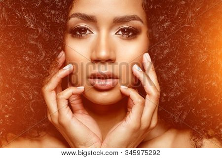 Beauty black skin woman African Ethnic female face. Young african american model with long afro hair. Lux model.