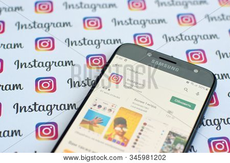 Instagram App On Samsung Smartphone Screen On Banner With Small Instagram Logos. Instagram Is Americ
