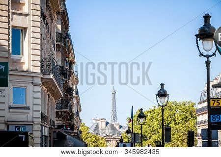 Paris/france - September 3, 2019 : Haussmann Building And Eiffel Tower View From A Parisian Boulevar