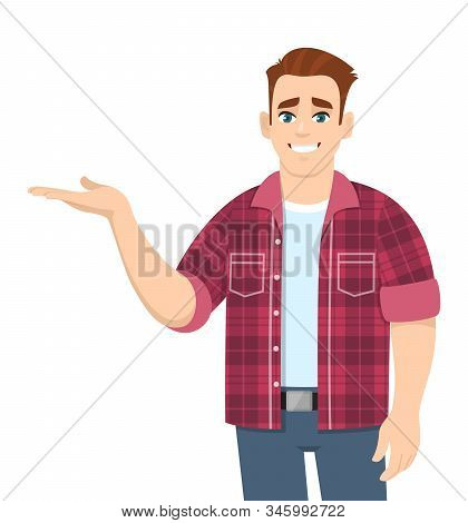 Happy Young Man Presenting Or Pointing Hand To Copy Space Side Away. Stylish Trendy Person In Casual